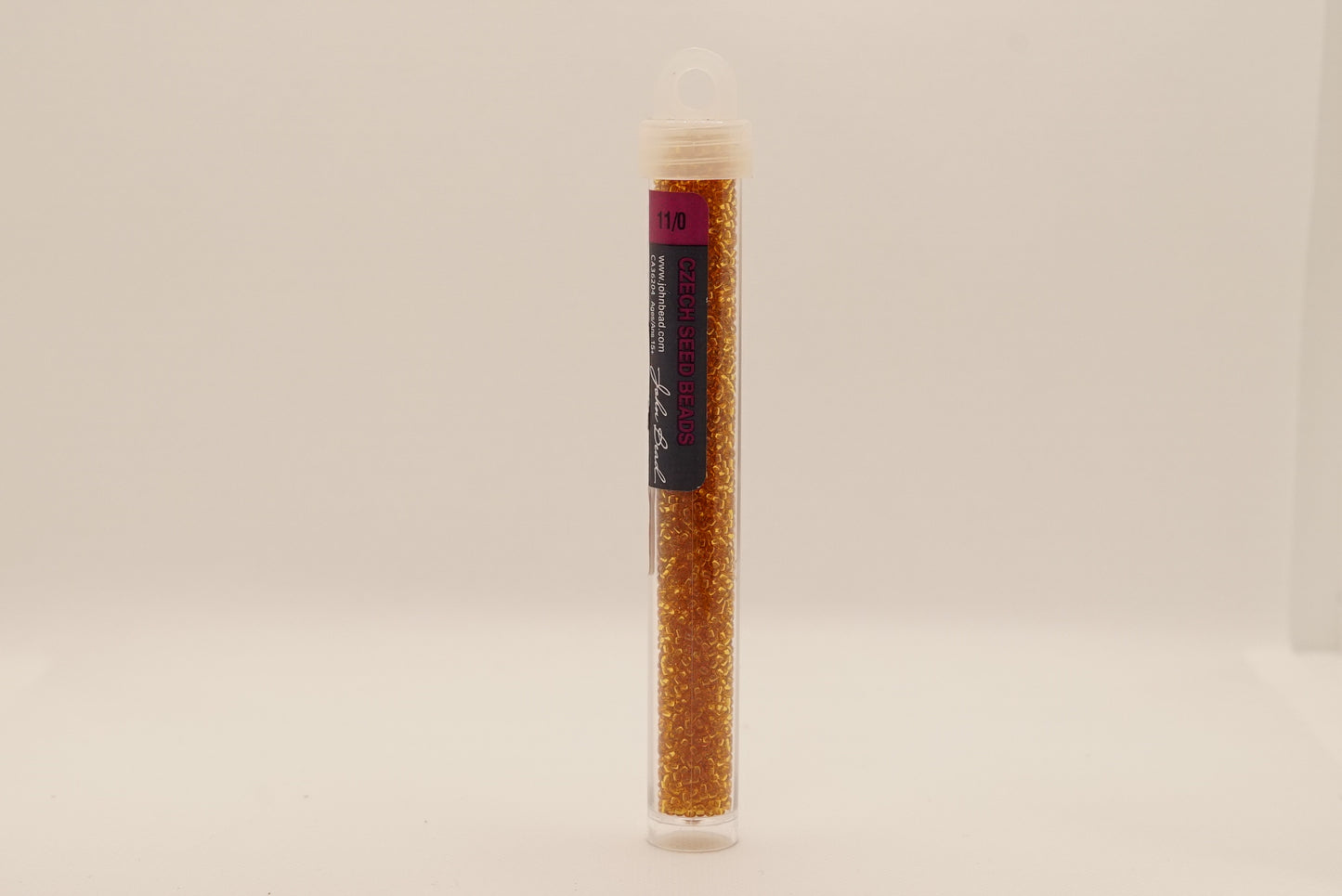 57 - 11/0 Vial Transparent Topaz