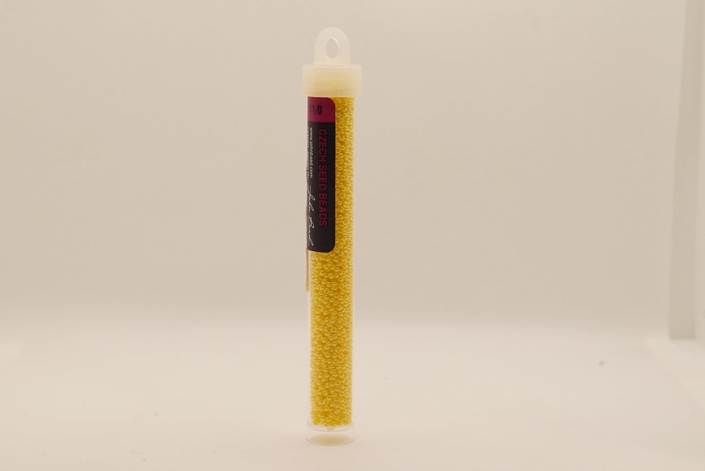 135 - 11/0 Vial Opaque Golden Yellow Luster