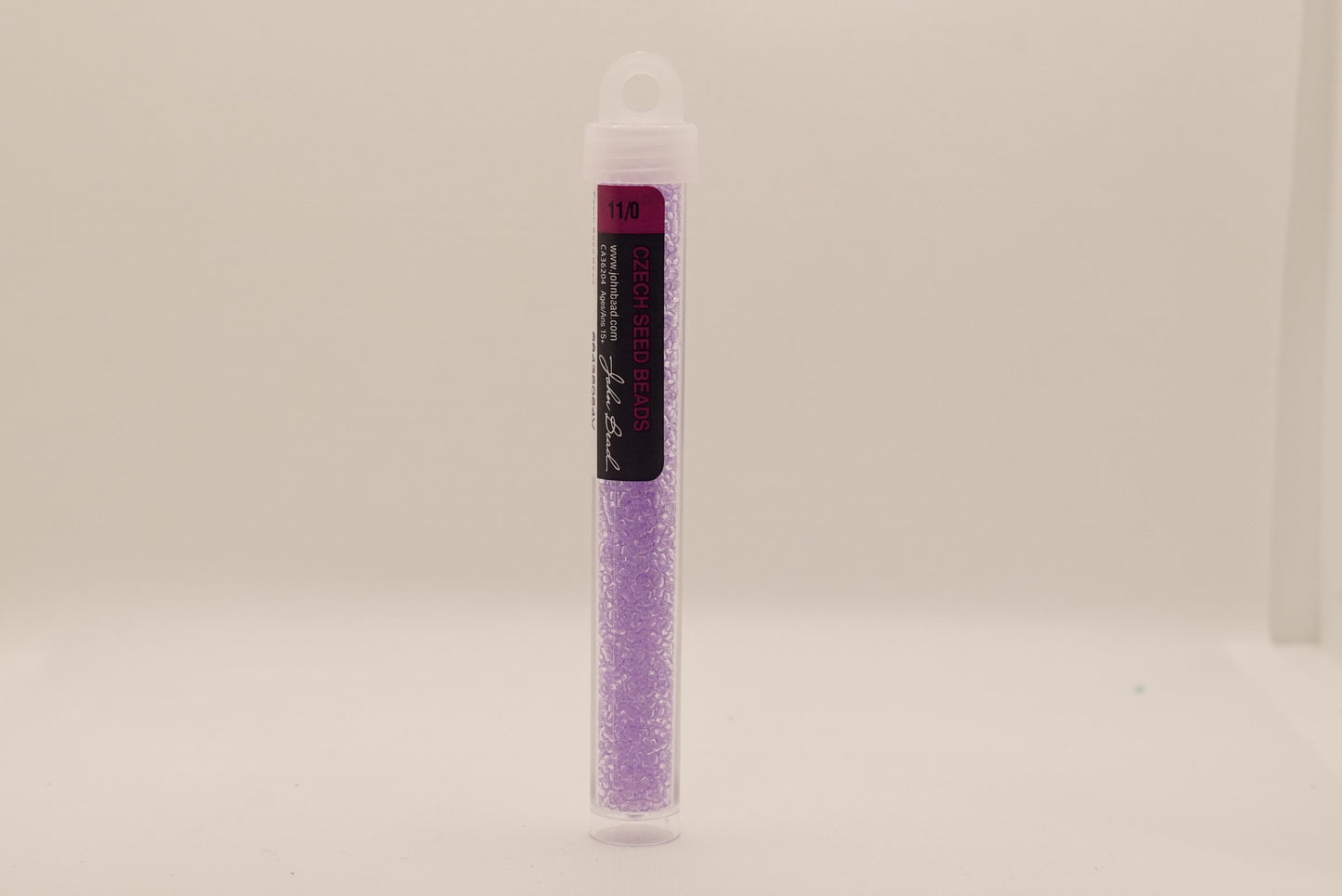 142 - 11/0 Vial Transparent Tanzanite Dyed