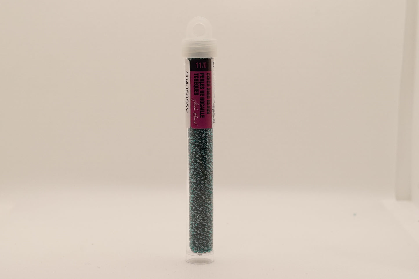 152 - 11/0 Vial Transparent Teal Luster