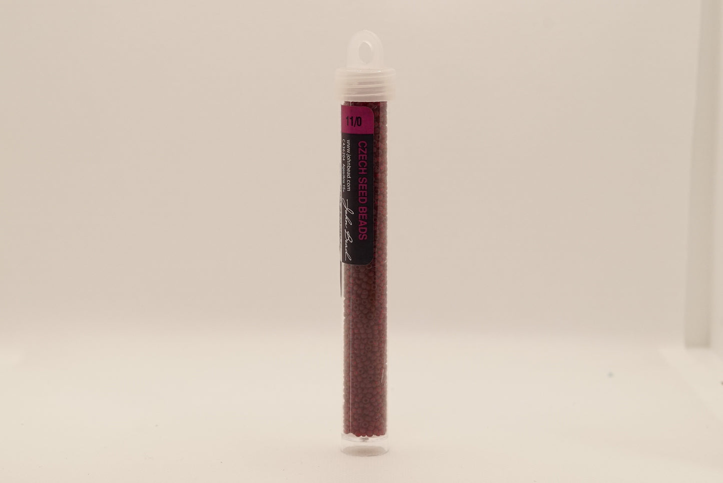157 - 11/0 Vial Transparent Garnet Matt