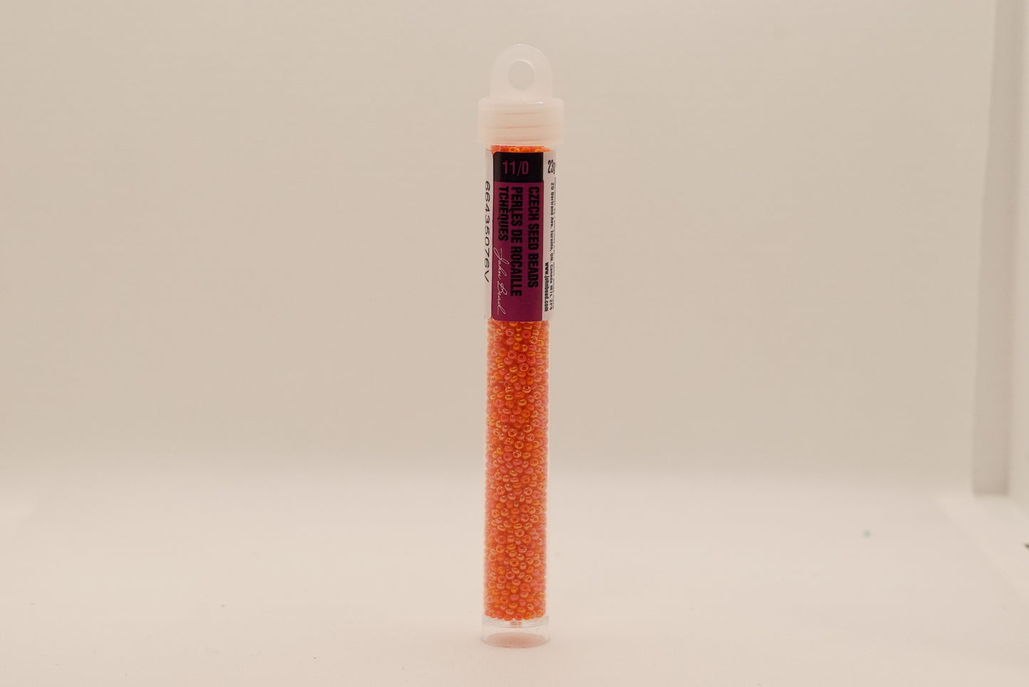 158 - 11/0 Vial Opaque Orange Rainbow Luster